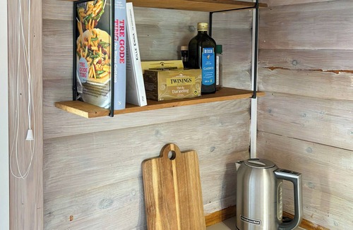 Tranekaer House | Log cabin in the front row overlooking the sea