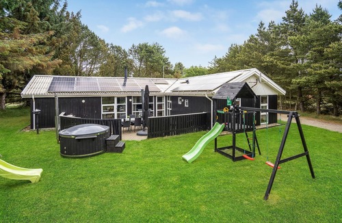 Vejers House | Look forward to an enjoyable vacation in this attractive vacation home with indoor pool.