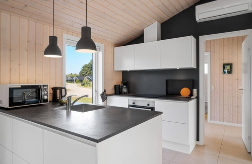 Nykøbing House | Look forward to a fantastic sandy beach near this inviting house with a large terrace.