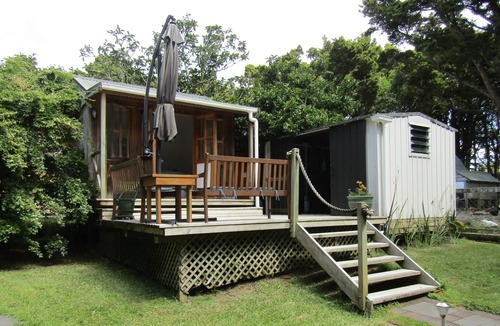 Kaipara Flats Cabin | Looking for a glamping experience with a difference? Try the Magnolia Room.