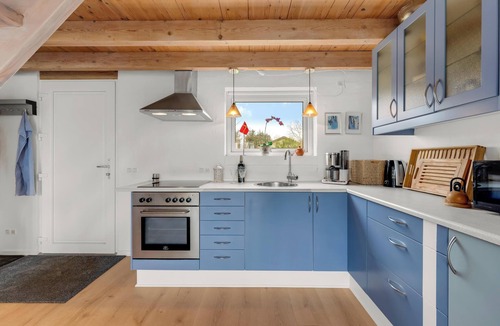 Skjern House | Lovely holiday home with a view of the fishing lake and the fjord.