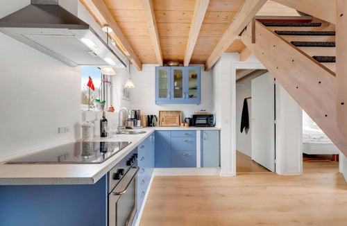 Skjern House | Lovely holiday home with a view of the fishing lake and the fjord.