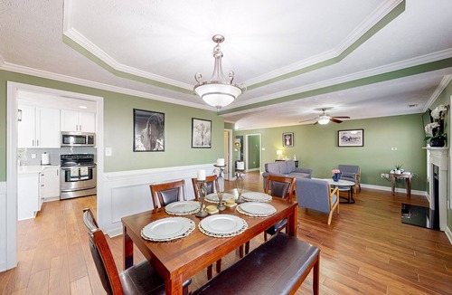 Cameron House | Lovely home with screened-in patio, fireplace, pool, playground, & gym access