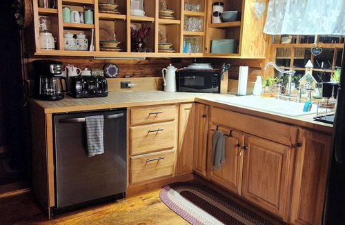 Bradford Cabin | Lovely Log Cabin Retreat: Cozy Fireplace, Beautiful Gardens & Nature