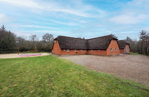 Øhuse House | Lovely pool house with jumping cushion and activity room.