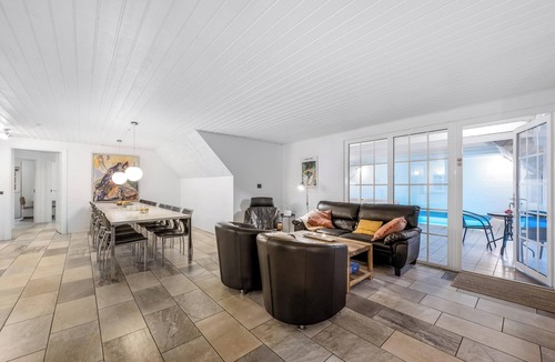 Øhuse House | Lovely pool house with jumping cushion and activity room.