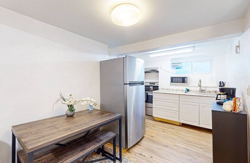 Haller Lake House | Lower-level home with fenced backyard, playground, BBQ, firepit, streaming, AC