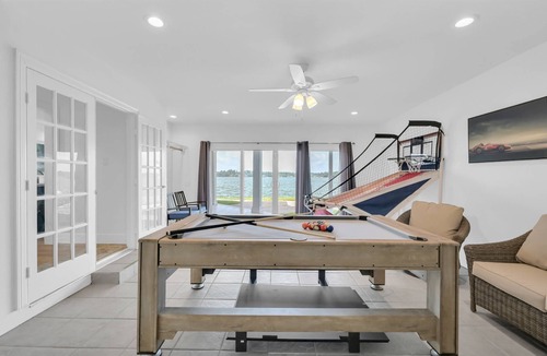 Walden on Lake Conroe House | Lux 6BR Lakefront Estate | Heated Spa | Gameroom | Private Dock | 60 Night Min