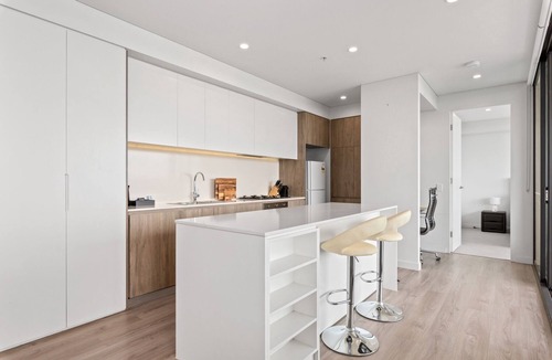 Lidcombe Apartment | Luxe 2-Bed: Modern Interiors, Balcony & BBQ Area