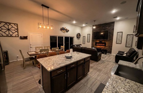 Biggs Field House | Luxurious El Paso Oasis: Modern 5BR, Huge Patio with Kitchen, TV, & Lounge Area