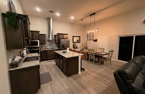 Biggs Field House | Luxurious El Paso Oasis: Modern 5BR, Huge Patio with Kitchen, TV, & Lounge Area