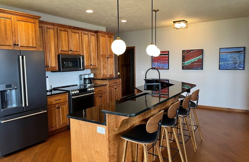 Arnolds Park Condo | Luxurious Lakefront BB Corner Condo.nPanoramic lake views & 6 waterpark passes.