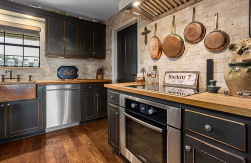 Glen Rose House | Luxurious property with pool, hot tub, wraparound porch, & two primary suites