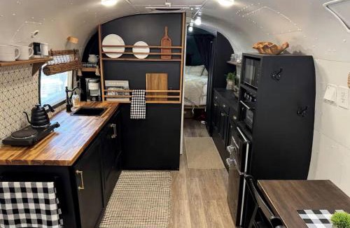 Honey Grove House | Luxurious Remodeled Airstream with Wraparound Deck and Spa near Honey Grove, Texas