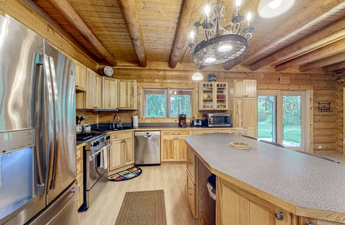 Tillamook Cabin | Luxurious riverfront log cabin with firepit, fireplace, & breathtaking scenery