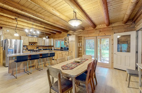 Tillamook Cabin | Luxurious riverfront log cabin with firepit, fireplace, & breathtaking scenery