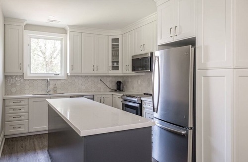 Kirkendall North Apartment | Luxury 2000 sq ft suite in Mini Mansion steps to Locke St. shops & restaurants.