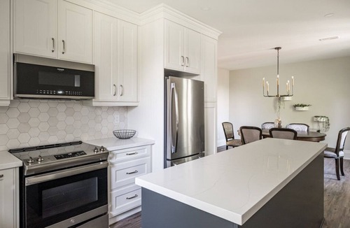 Kirkendall North Apartment | Luxury 2000 sq ft suite in Mini Mansion steps to Locke St. shops & restaurants.