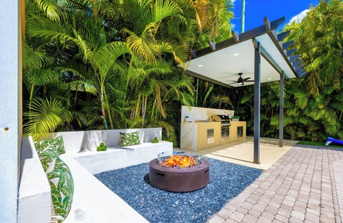 Hialeah House | Luxury 6BR Oasis w/Pool, Fire Pit & Game Area Sleeps 18