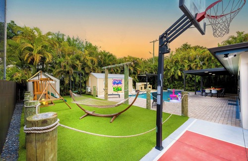 Hialeah House | Luxury 6BR Oasis w/Pool, Fire Pit & Game Area Sleeps 18