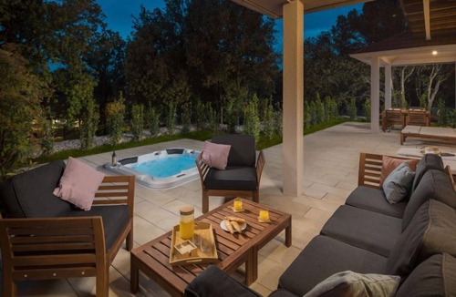 Bale House | Luxury Bay Villa with private hot tub by Interhome