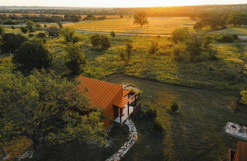 Stonewall Cabin | Luxury cabin in the center of the Texas Wine Country; large private porch w/hot tub, gas grill and fire pit; pet friendly