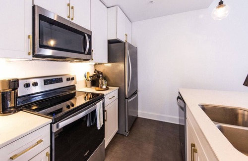 East Town Apartment | Luxury Downtown Apt with Parking, Gym, and Lap Pool