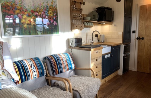 Coalpit Heath Ski Chalet | Luxury heated shepherd's hut in field location.