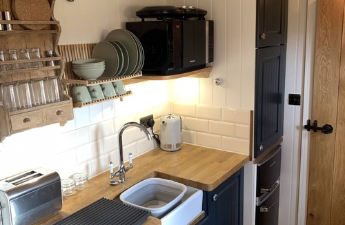 Coalpit Heath Ski Chalet | Luxury heated shepherd's hut in field location.