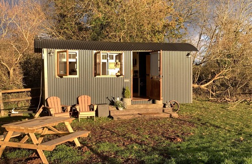 Coalpit Heath Ski Chalet | Luxury heated shepherd's hut in field location.