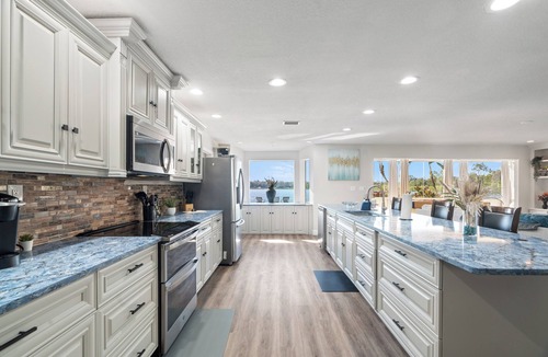 Seffner Community Alliance House | Luxury Hideaway - Lakefront - Mini Golf, Pool + More!