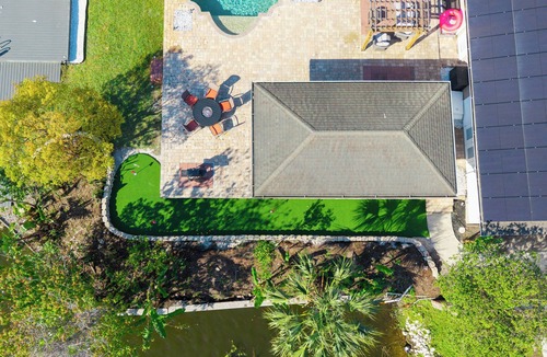 Seffner Community Alliance House | Luxury Hideaway - Lakefront - Mini Golf, Pool + More!