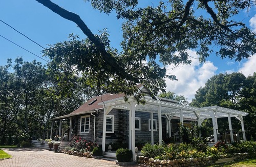 Edgartown Villa | Luxury Log Villa with Endless Pool, Hot Tub & Expansive Grounds