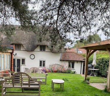 West Heath House | Luxury rural thatched cottage with cedar hot tub
