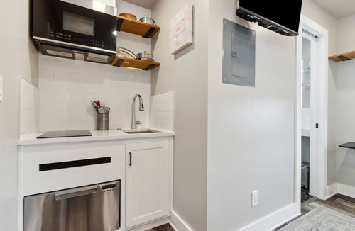 Ocean Cay Apartment | Luxury Studio Steps to Beach Kitchenette Outdoor Seating Partial View Upstairs