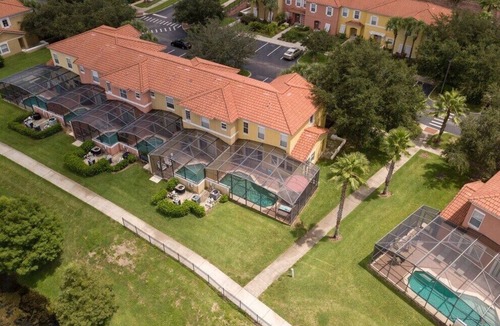 Sunset Lakes House | Luxury Villa With Large Private Patio & South Facing Pool Overlooking a Lake