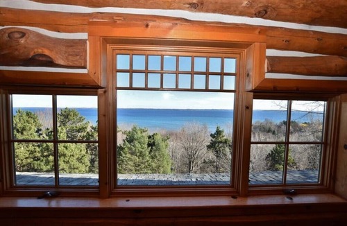 Suttons Bay House | Luxury Waterfront Log Home 15 min from Traverse City w/Dock
