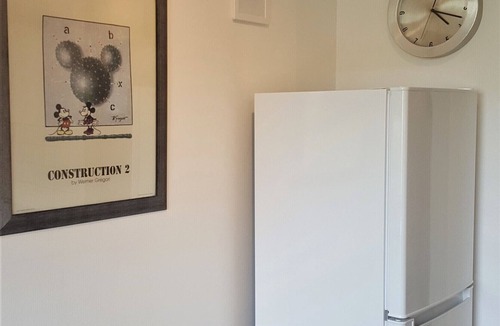 Brabrand Condo | M H Homes Apartments with a fully equipped kitchen.