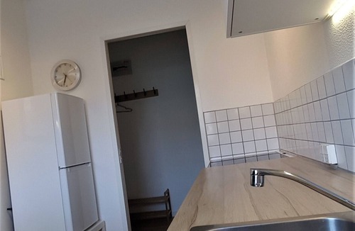 Brabrand Condo | M H Homes Apartments with a fully equipped kitchen.