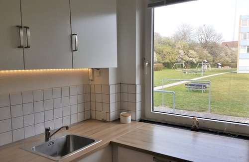 Brabrand Condo | M H Homes Apartments with a fully equipped kitchen.