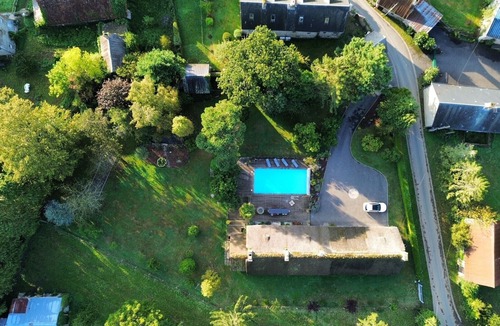 Conde-sur-Noireau Villa | Magnificent stone villa with thatched roof and heated swimming pool