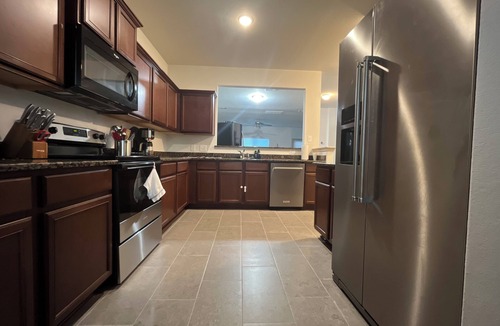 Magnolia House | Magnolia Blooms: Spacious 5-BR 3.5 BA, tranquil, vibrant community.