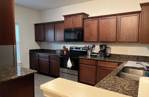 Magnolia House | Magnolia Blooms: Spacious 5-BR 3.5 BA, tranquil, vibrant community.