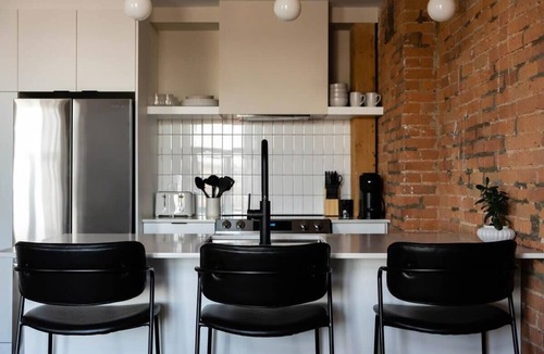 Old Montreal Apartment | Maison Place Royale Luxury Waterfront One-Bedroom Apartment Old Montreal Water View St. Lawrence River Full Kitchen Stone Walls Wi-Fi AC
