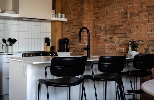 Old Montreal Apartment | Maison Place Royale Luxury Waterfront One-Bedroom Apartment Old Montreal Water View St. Lawrence River Full Kitchen Stone Walls Wi-Fi AC