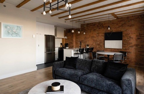 Old Montreal Apartment | Maison Place Royale Luxury Waterfront One-Bedroom Apartment Old Montreal Water View St. Lawrence River Full Kitchen Stone Walls Wi-Fi AC
