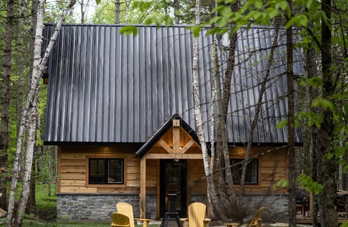 Trois-Rives Ski Chalet | Majestic chalet with spa at the water's edge.