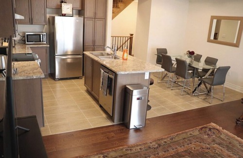 Markham House | Markham home near Toronto with dual patios, bright