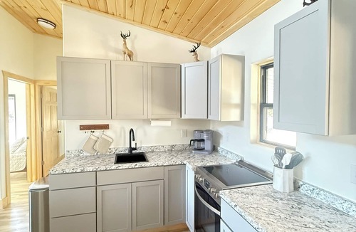 Roach House | Marvelous New 5-bedroom tiny house with AC in charming Roach on the water