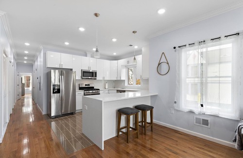 McGinley Square Apartment | Massive 4-bedroom, 3-bathroom apartment with shared yard & bonus garage parking